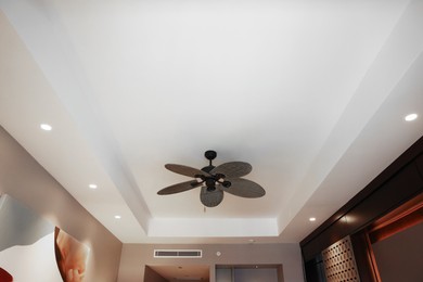 Modern ceiling fan indoors, low angle view