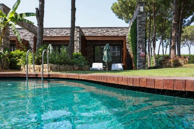 Outdoor swimming pool with clear water at luxury resort