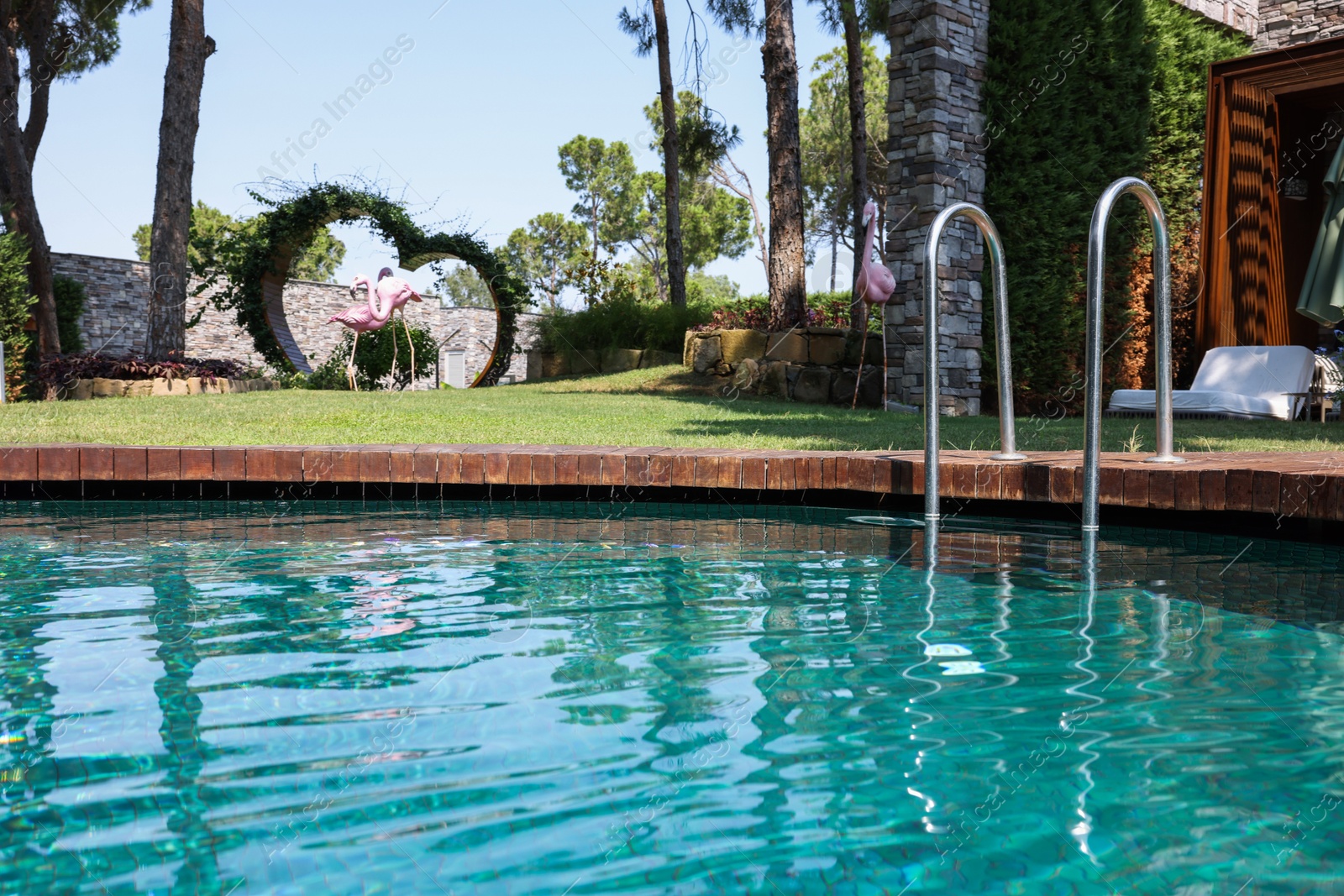 Photo of Outdoor swimming pool with clear water at luxury resort