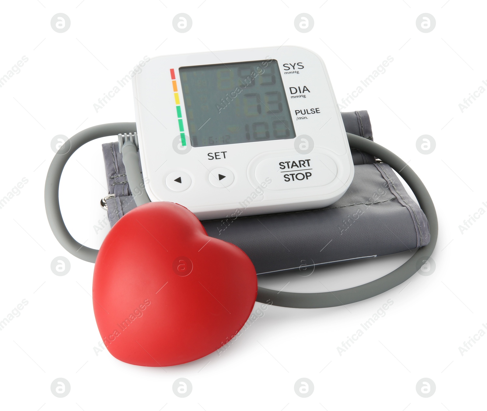 Photo of Blood pressure measuring device and red heart figure isolated on white