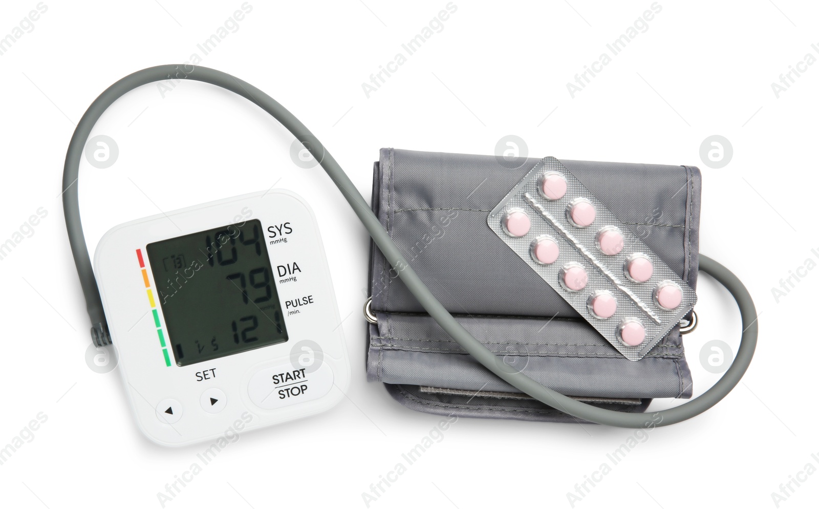 Photo of Blood pressure measuring device and pill blister isolated on white, top view