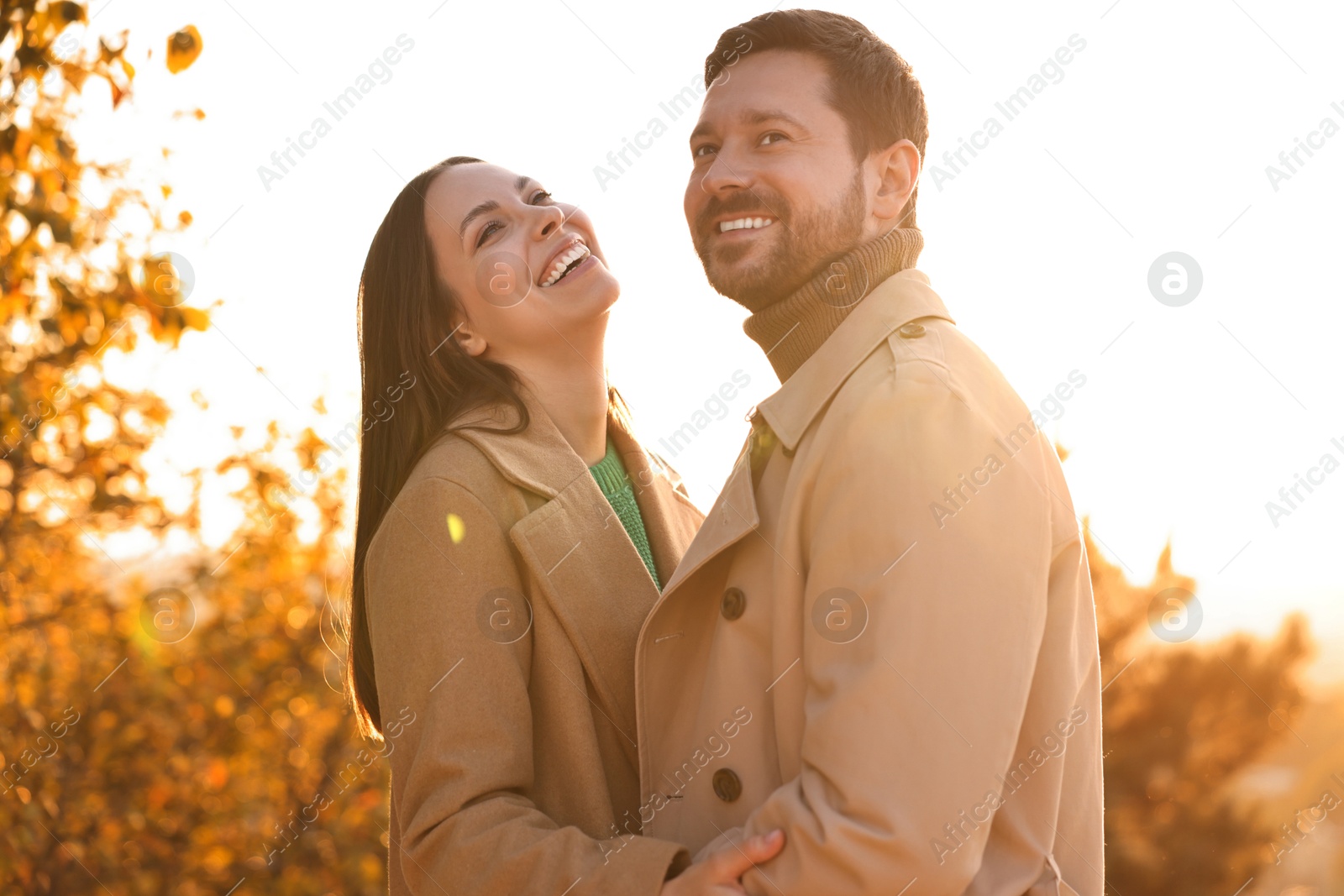 Photo of Beautiful couple spending time together in autumn park