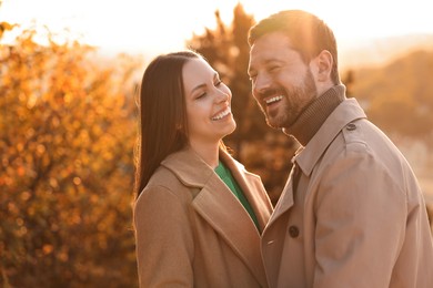 Photo of Beautiful couple spending time together in autumn park