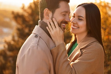 Beautiful couple spending time together in autumn park