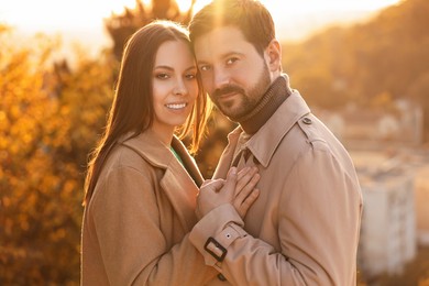 Photo of Beautiful couple enjoying their time together outdoors in autumn evening