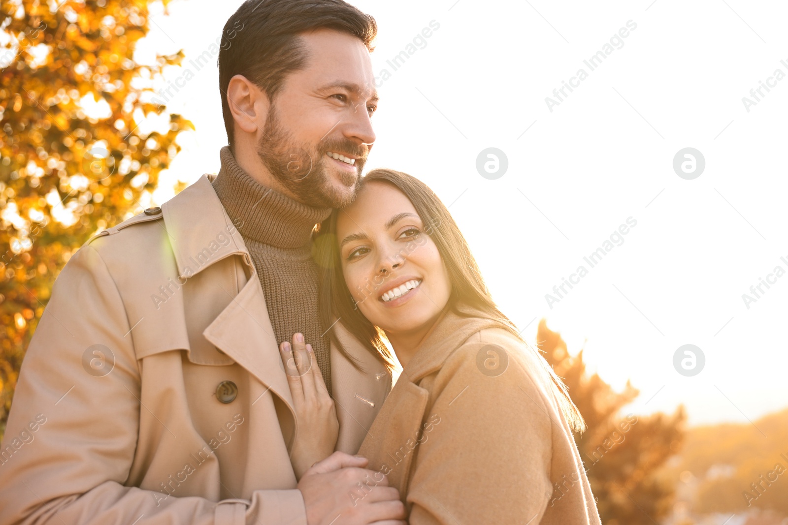 Photo of Beautiful couple enjoying their time together outdoors in autumn evening