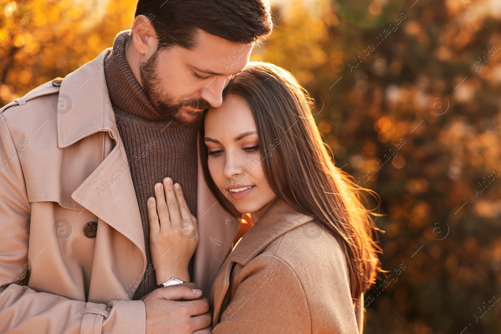 Photo of Beautiful couple enjoying their time together outdoors in autumn evening