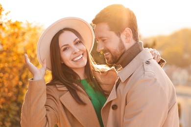 Photo of Beautiful couple spending time together in autumn park