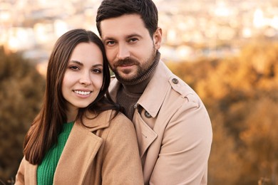 Portrait of beautiful couple outdoors on autumn day