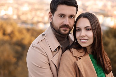 Portrait of beautiful couple outdoors on autumn day