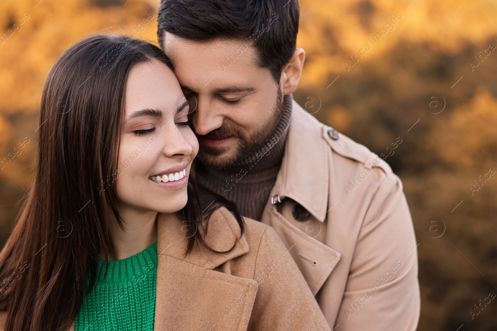 Photo of Beautiful couple spending time together outdoors on autumn day