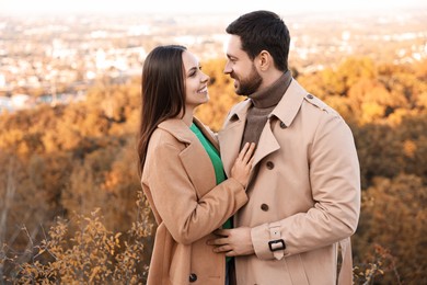 Photo of Beautiful couple spending time together outdoors on autumn day