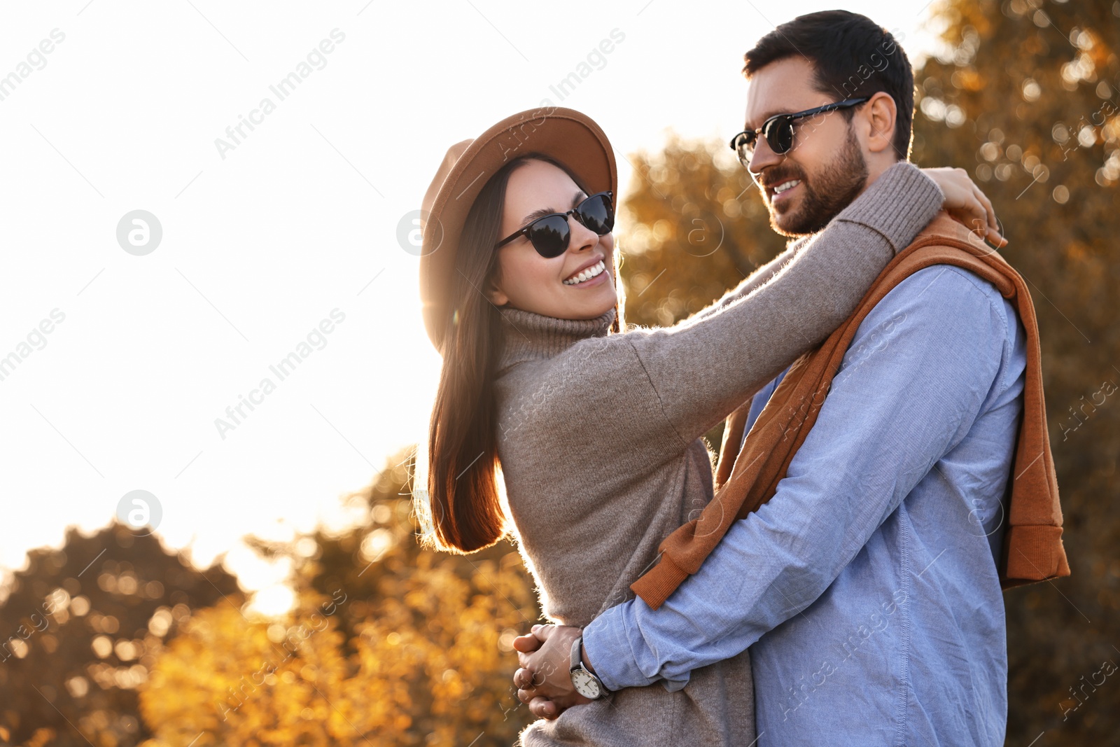 Photo of Beautiful couple spending time together in autumn park