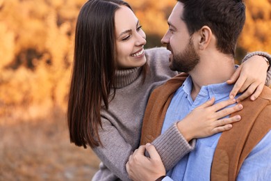 Photo of Beautiful couple spending time together outdoors on autumn day