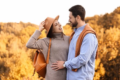 Photo of Beautiful couple spending time together outdoors on autumn day