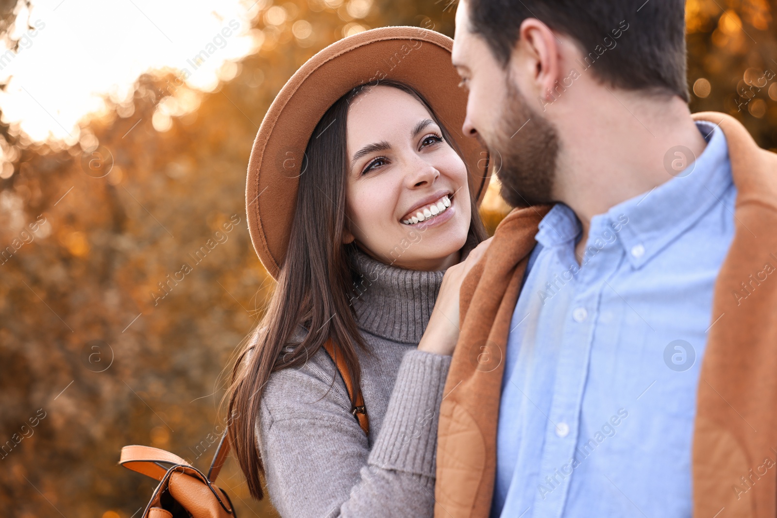 Photo of Beautiful couple spending time together outdoors on autumn day