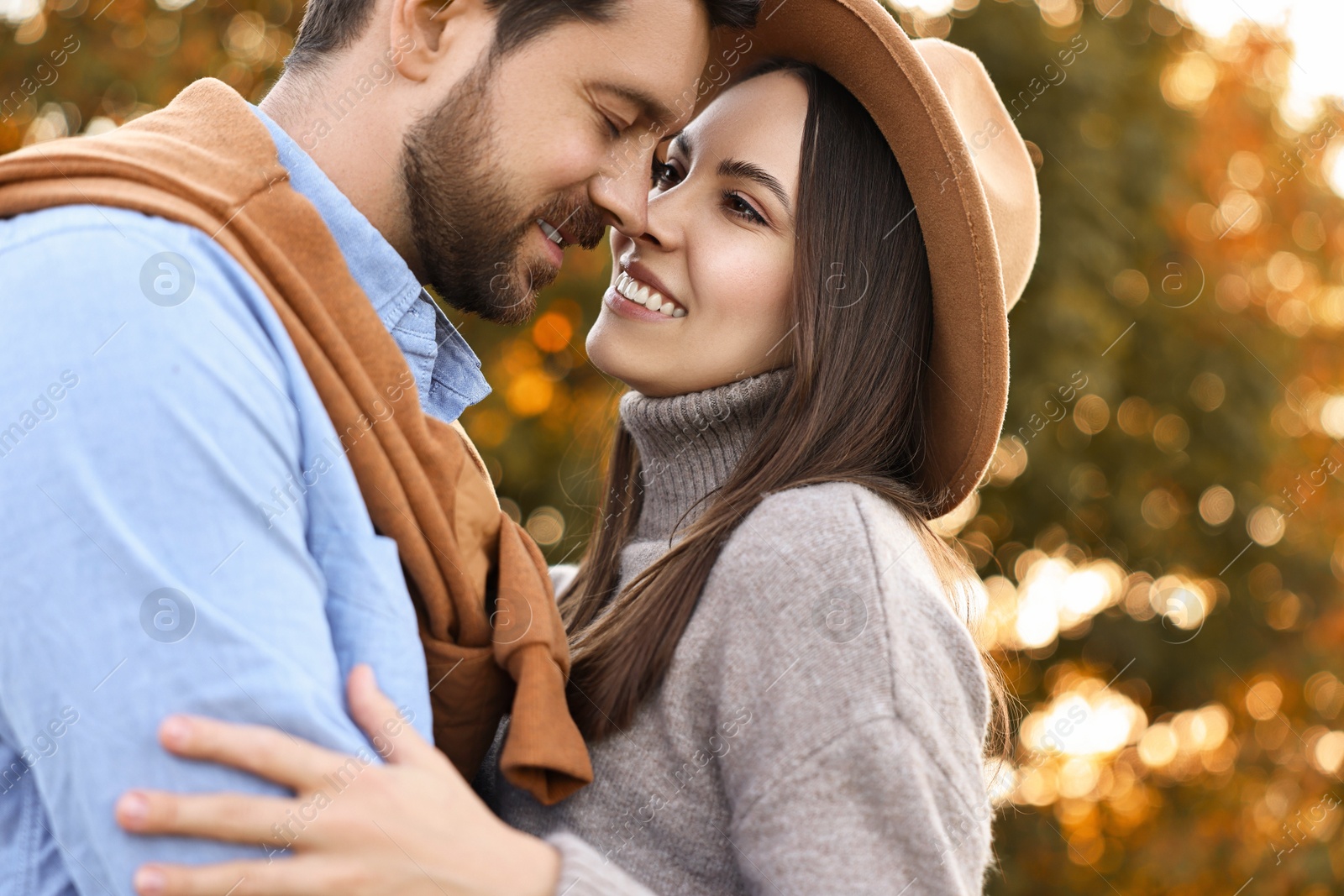 Photo of Beautiful couple spending time together outdoors on autumn day