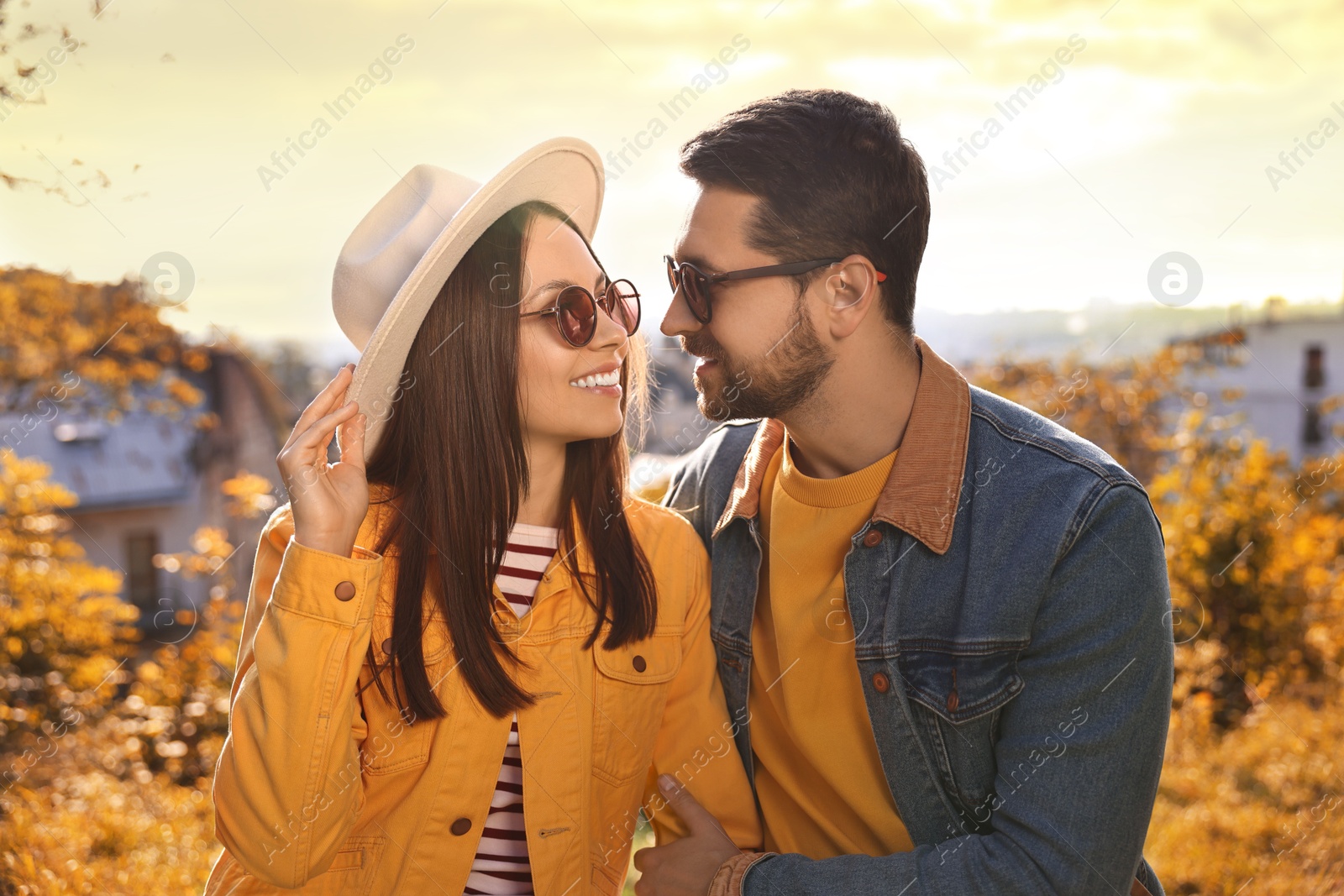 Photo of Beautiful couple in sunglasses outdoors on autumn day