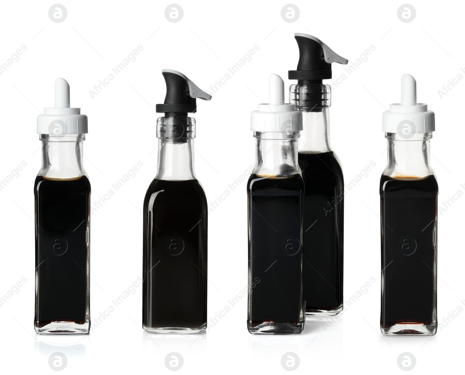 Image of Tasty balsamic vinegar in bottles on white background, set