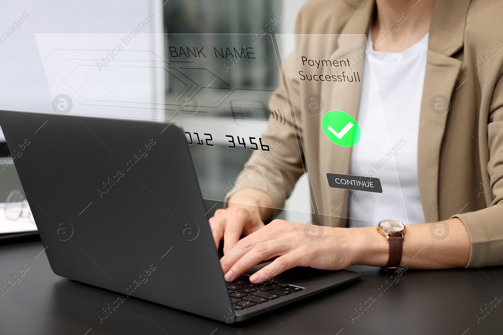 Image of Online payment system interface over computer. Woman working on laptop at desk in office, closeup