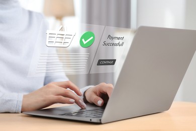 Online payment system interface over computer. Woman working on laptop at desk in office, closeup