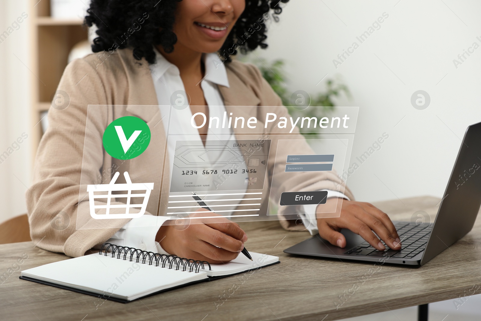 Image of Online payment system interface over computer. Woman working on laptop at desk in office, closeup