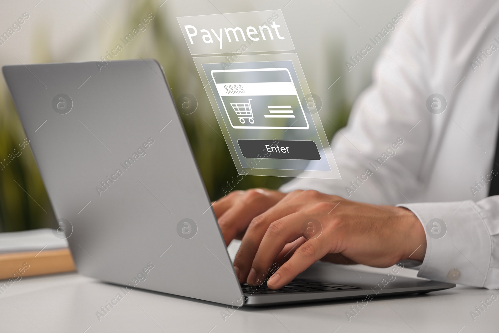 Image of Online payment system interface over computer. Man working on laptop at desk, closeup