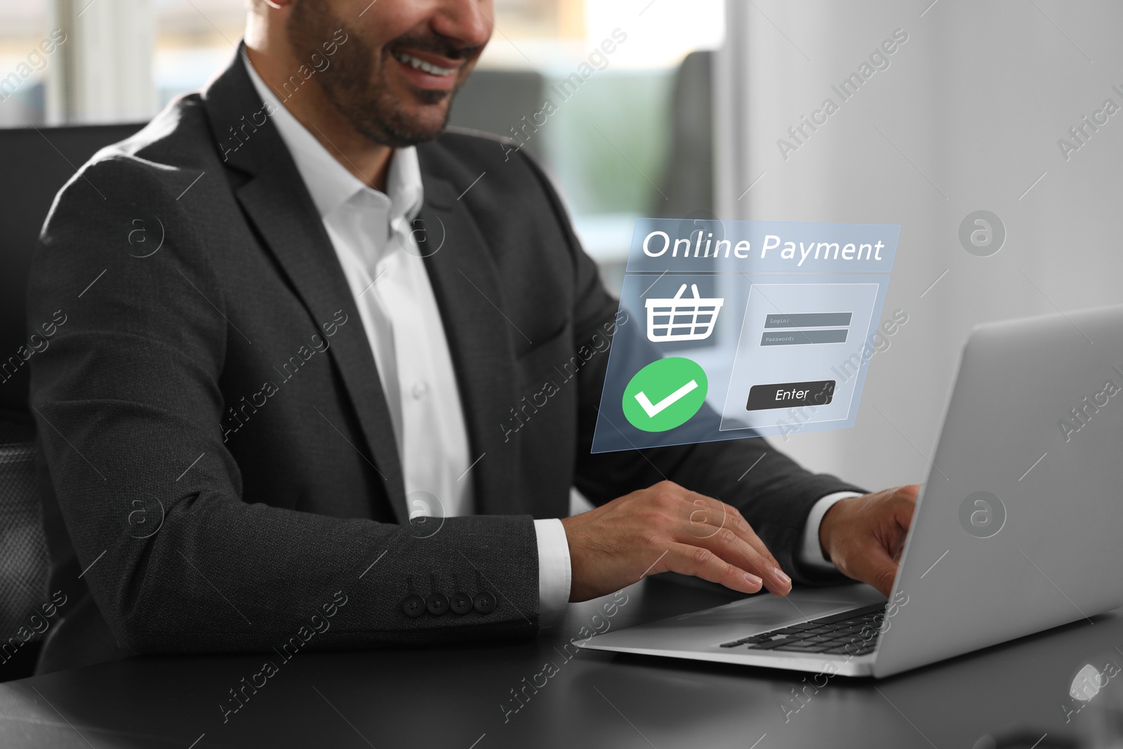 Image of Online payment system interface over computer. Man working on laptop at desk in office, closeup