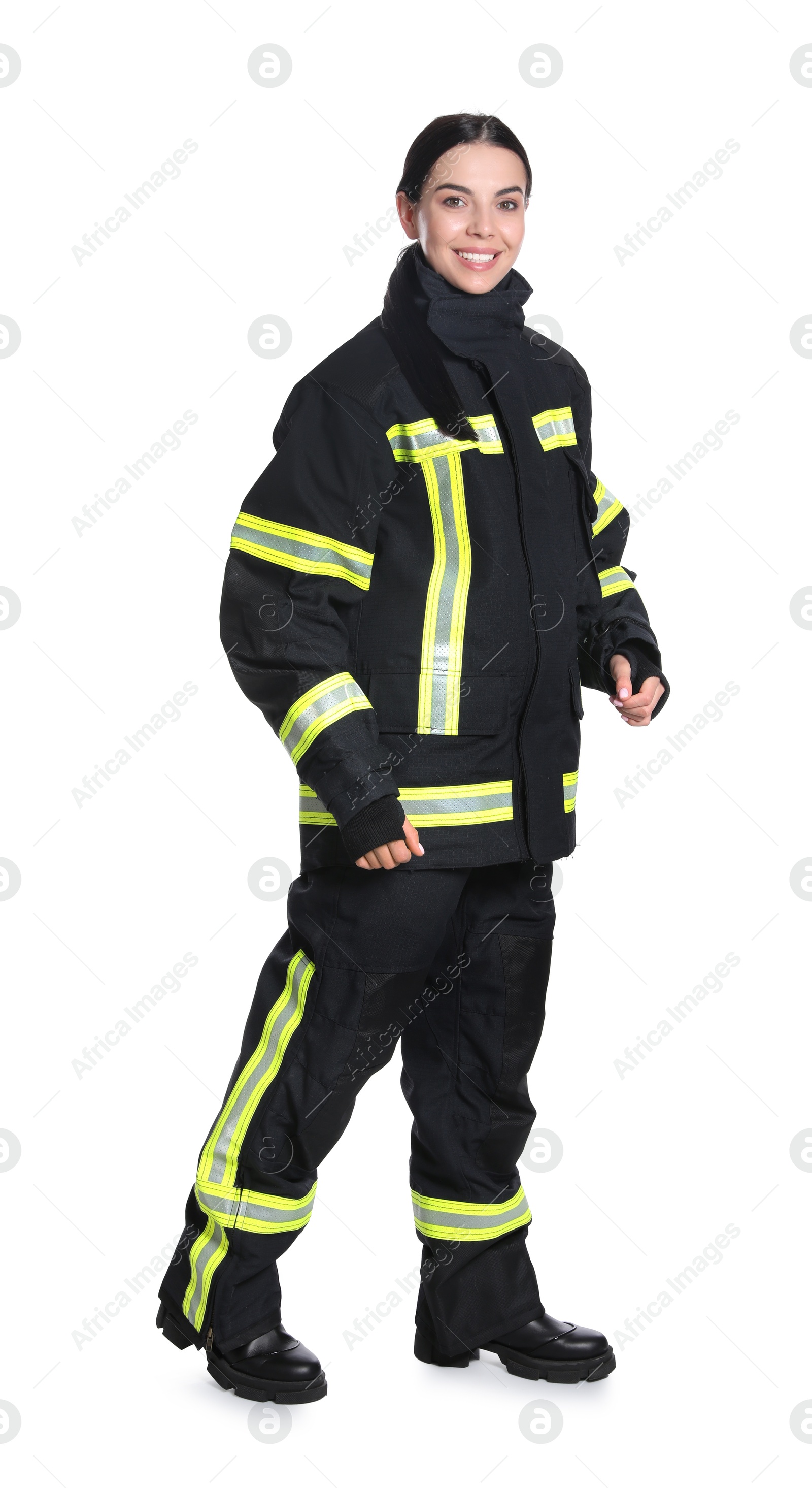 Photo of Full length portrait of firefighter in uniform on white background