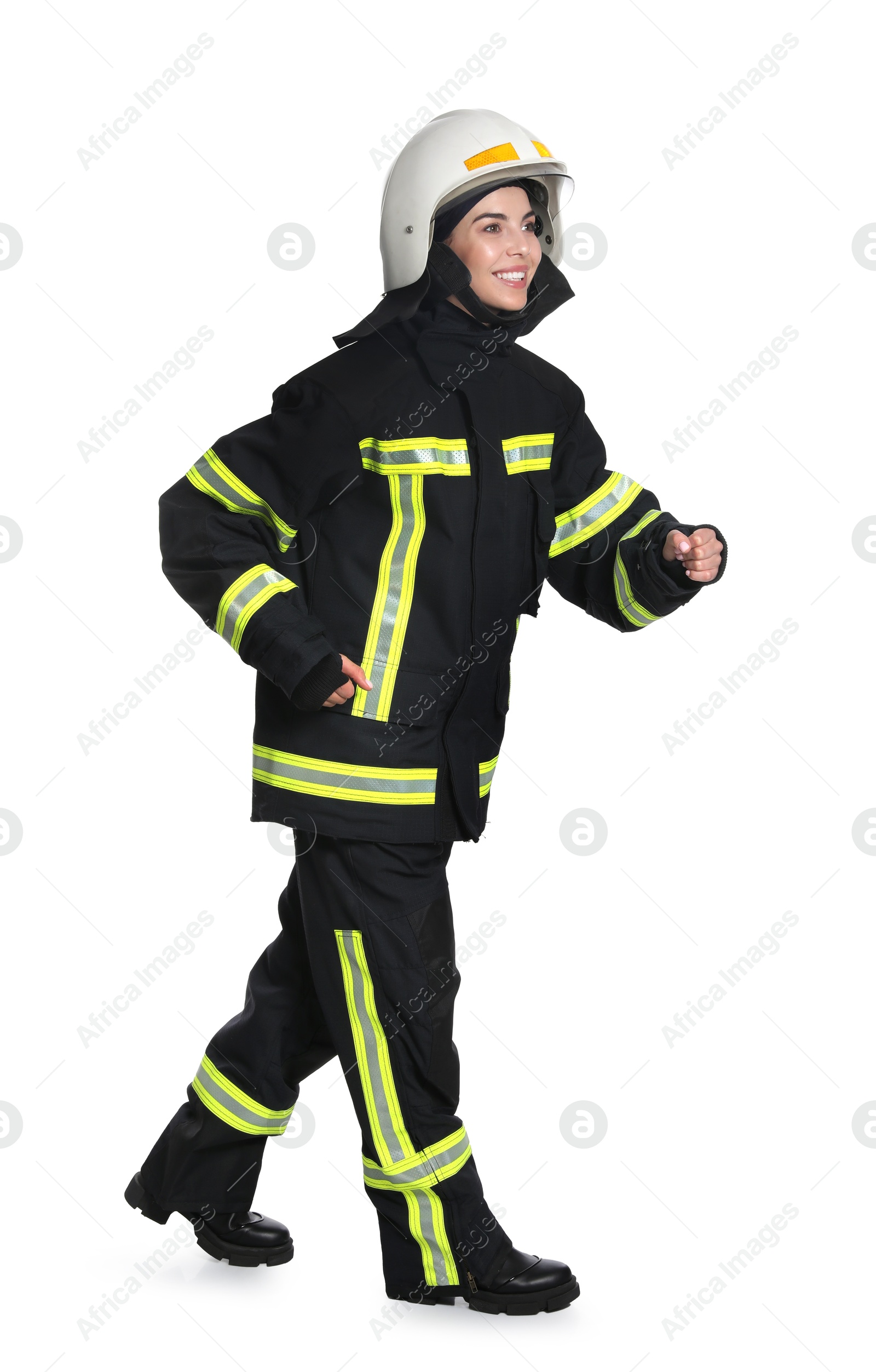 Photo of Full length portrait of firefighter in uniform and helmet on white background