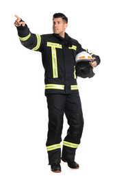 Full length portrait of firefighter in uniform with helmet on white background