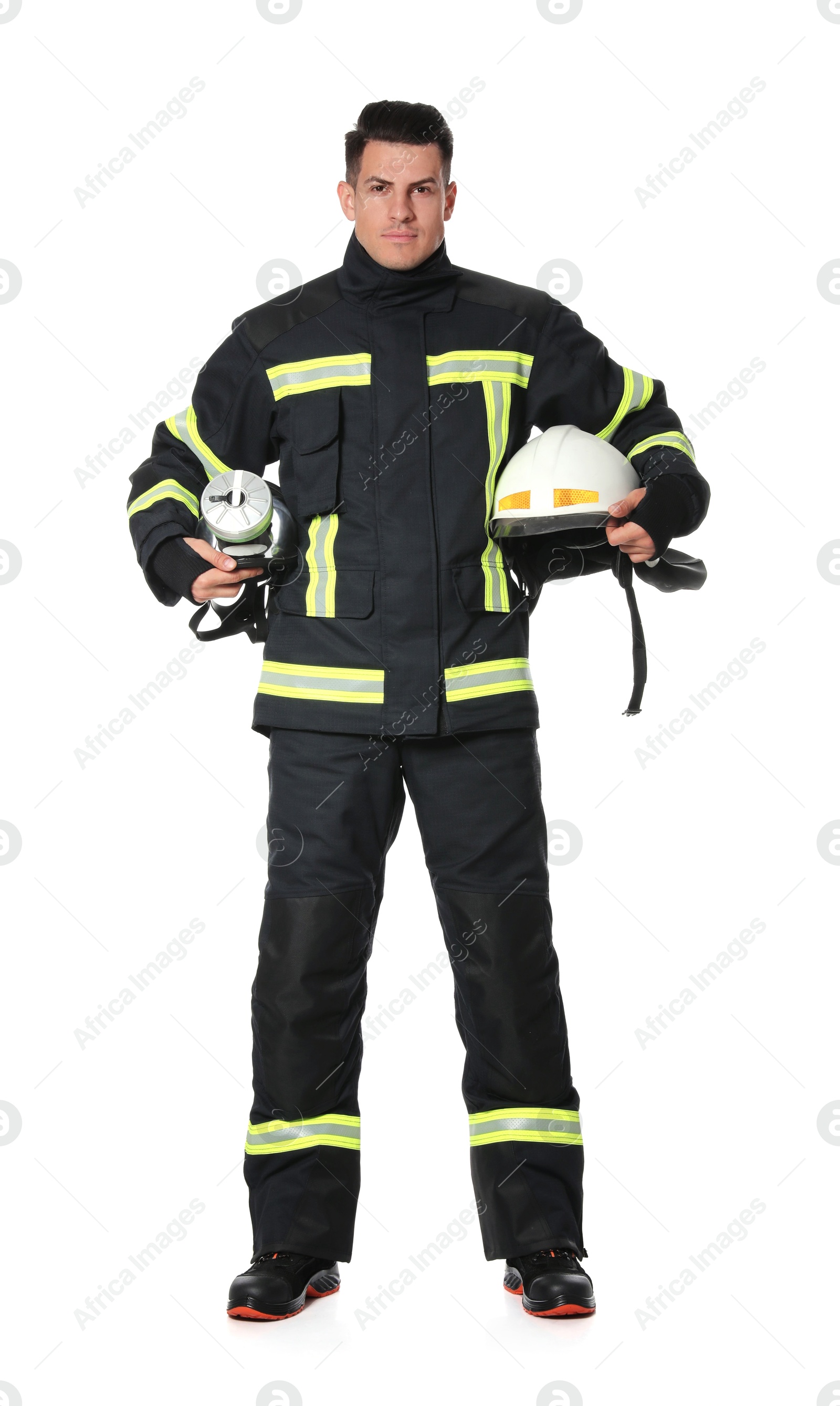 Photo of Full length portrait of firefighter in uniform with helmet and gas mask on white background