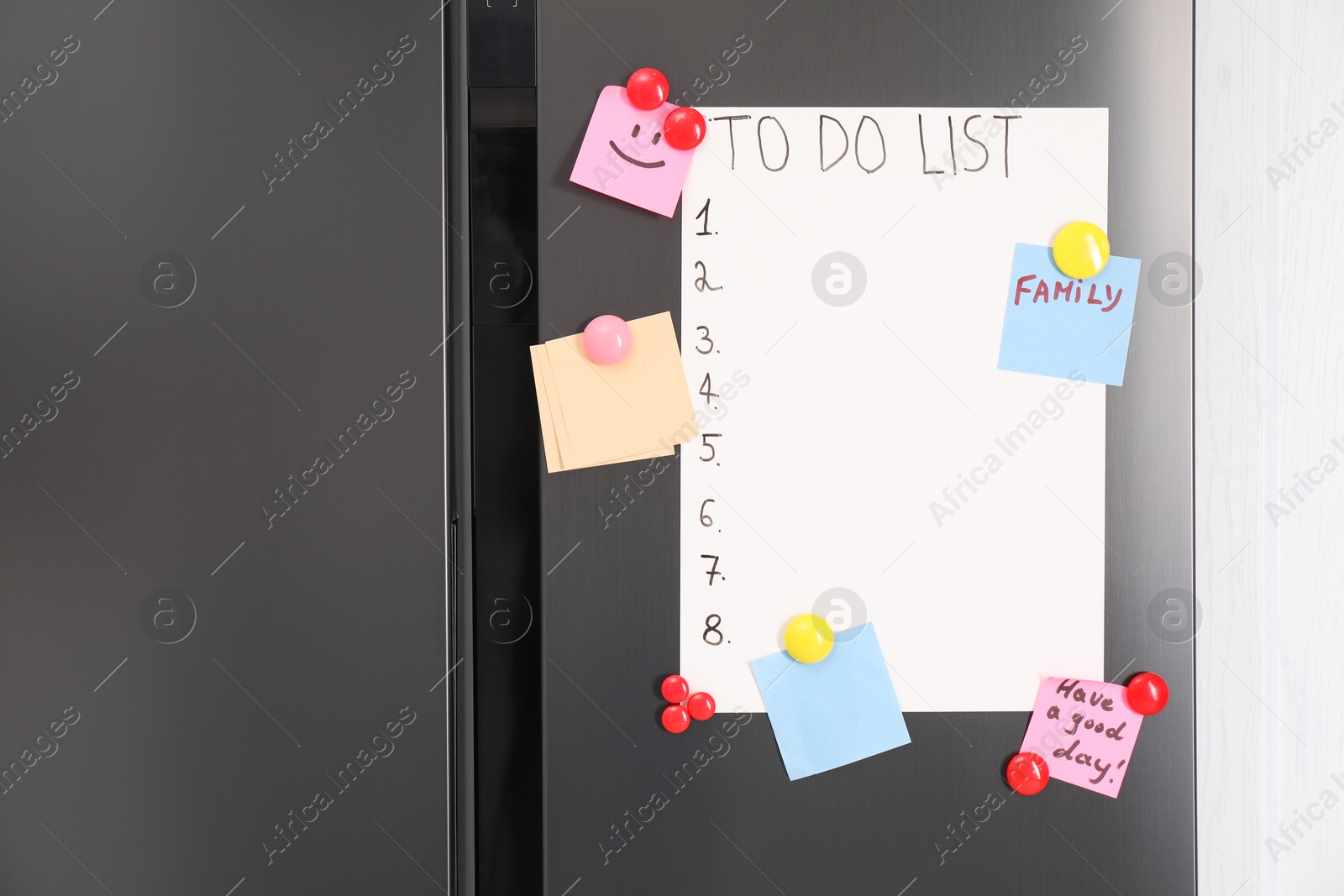 Photo of Magnetic board with to do list and notes on refrigerator in kitchen