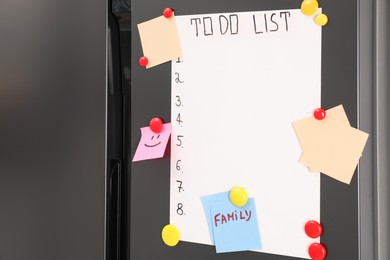 Magnetic board with to do list and notes on refrigerator