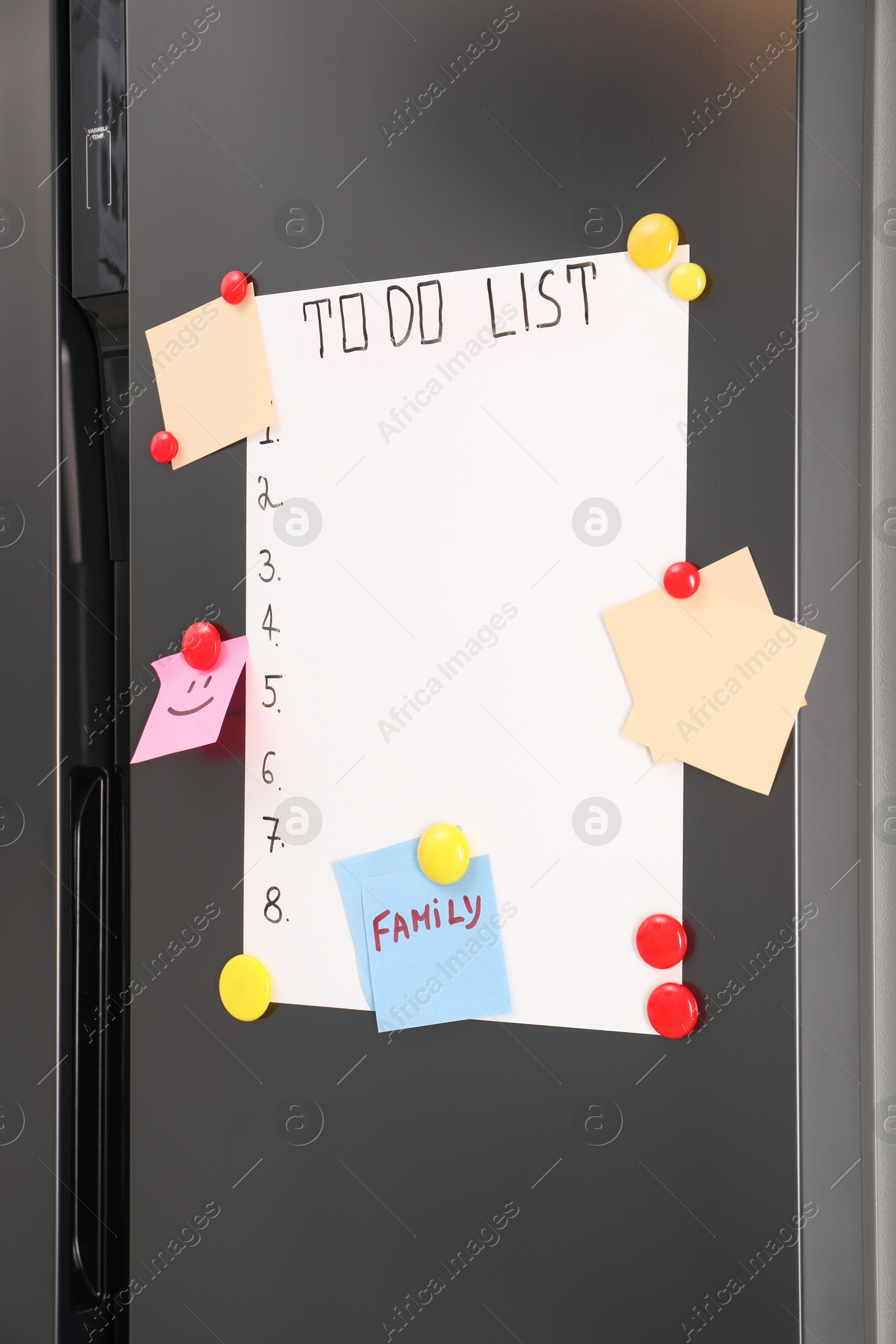 Photo of Magnetic board with to do list and notes on refrigerator