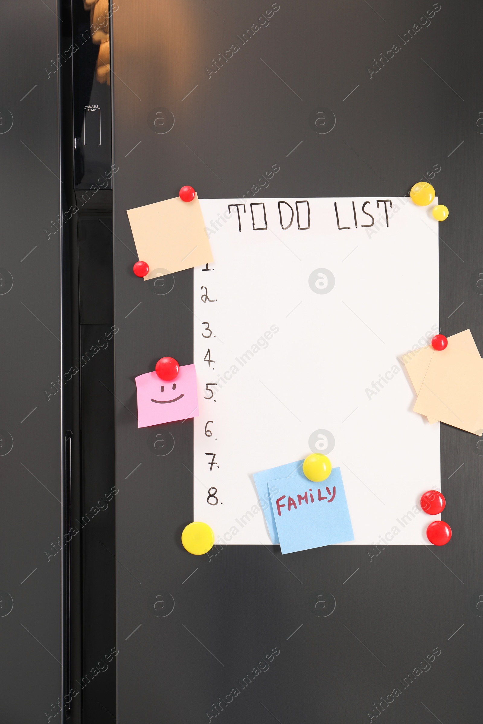 Photo of Magnetic board with to do list and notes on refrigerator