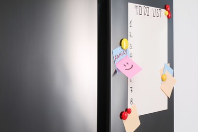 Photo of Magnetic board with to do list and notes on refrigerator