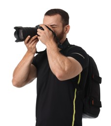 Photographer with backpack and camera taking picture on white background