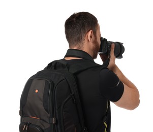 Photo of Photographer with backpack and camera taking picture on white background, back view