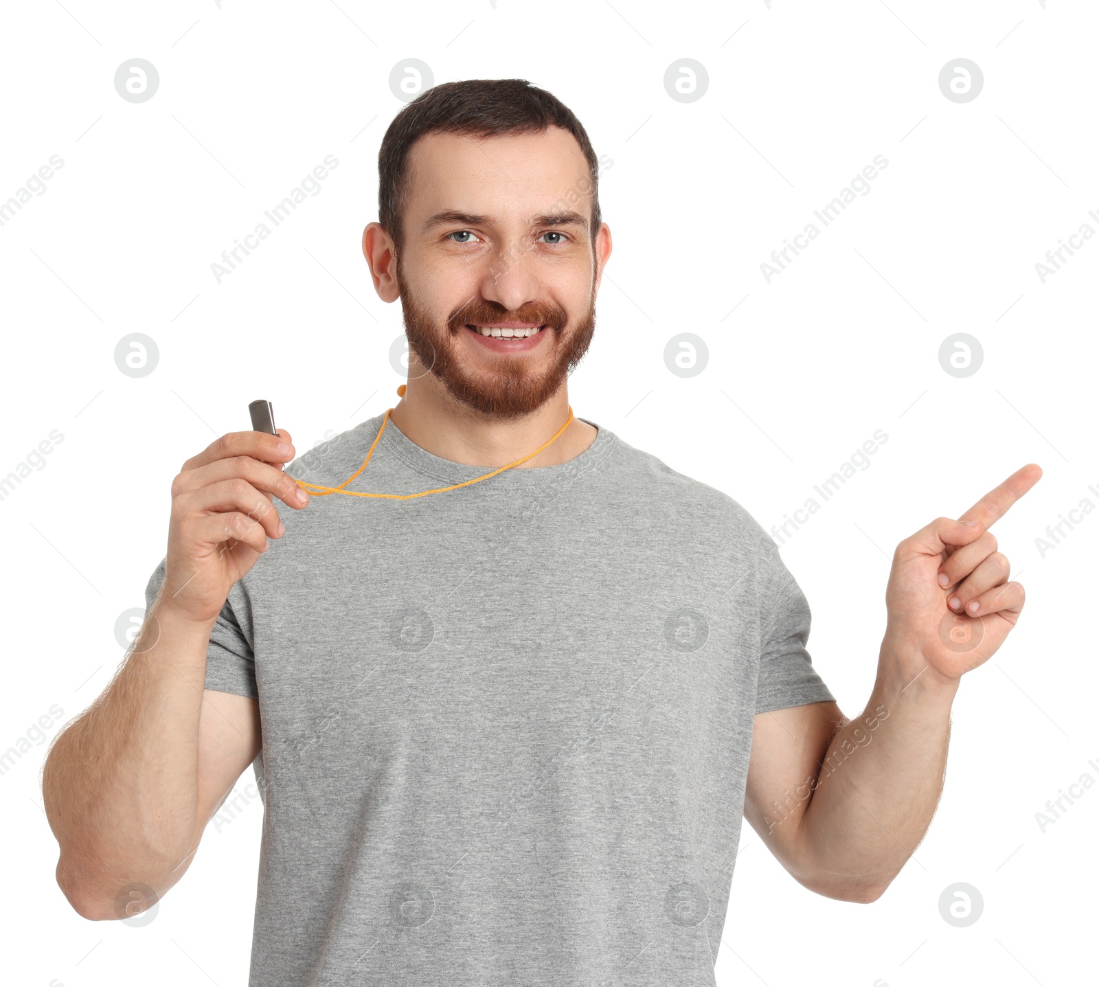 Photo of Happy young man with whistle on white background