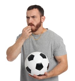 Man with soccer ball blowing whistle on white background