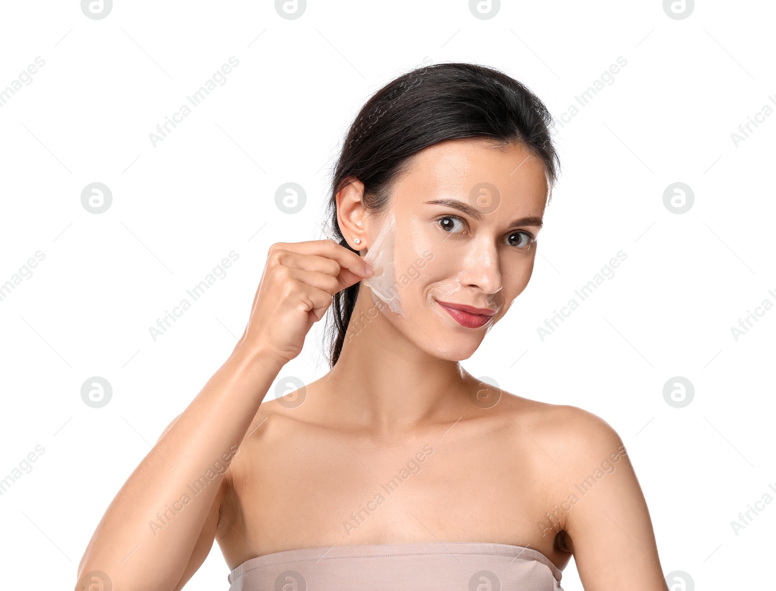 Photo of Beautiful woman peeling off face mask on white background