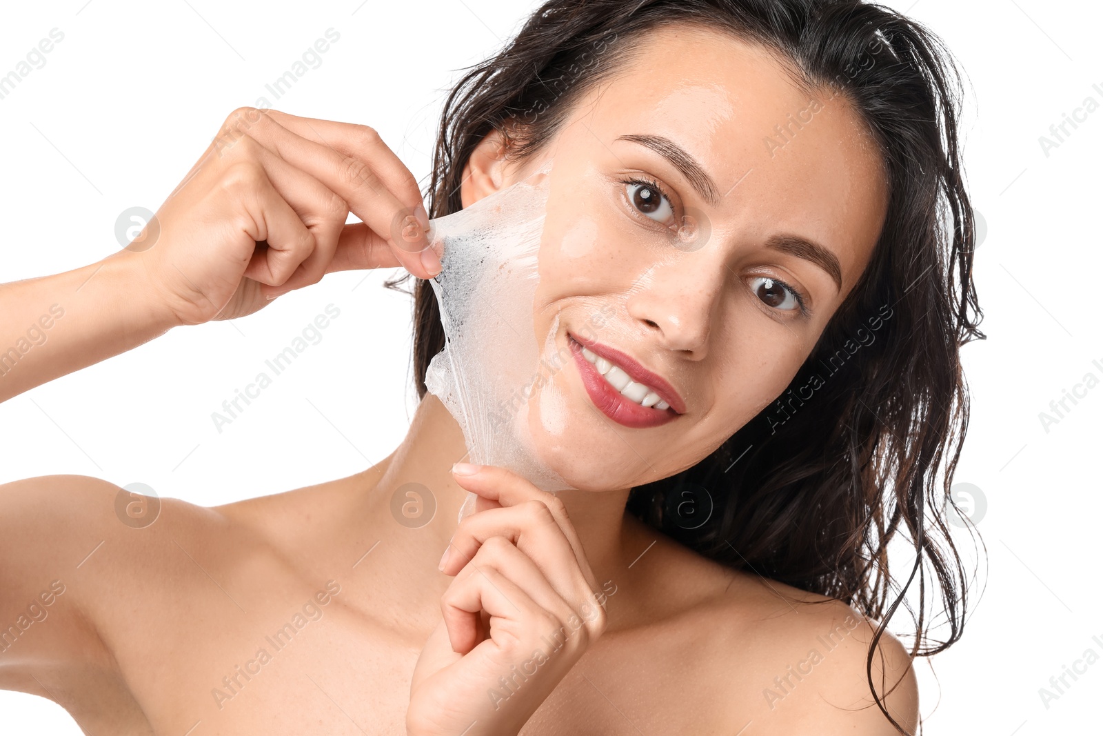 Photo of Smiling woman peeling off face mask on white background