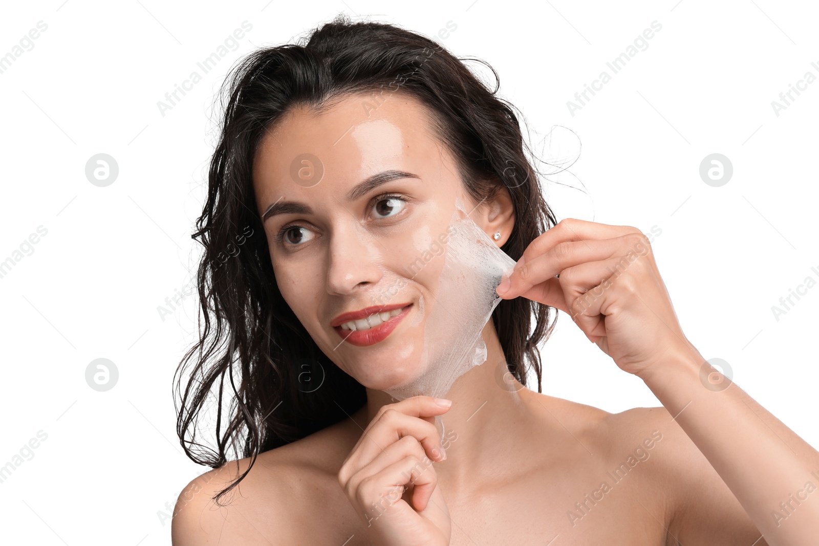 Photo of Smiling woman peeling off face mask on white background