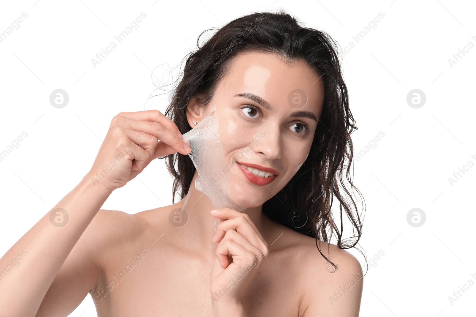 Photo of Smiling woman peeling off face mask on white background