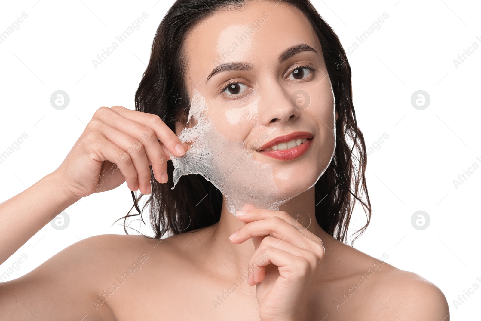 Photo of Smiling woman peeling off face mask on white background