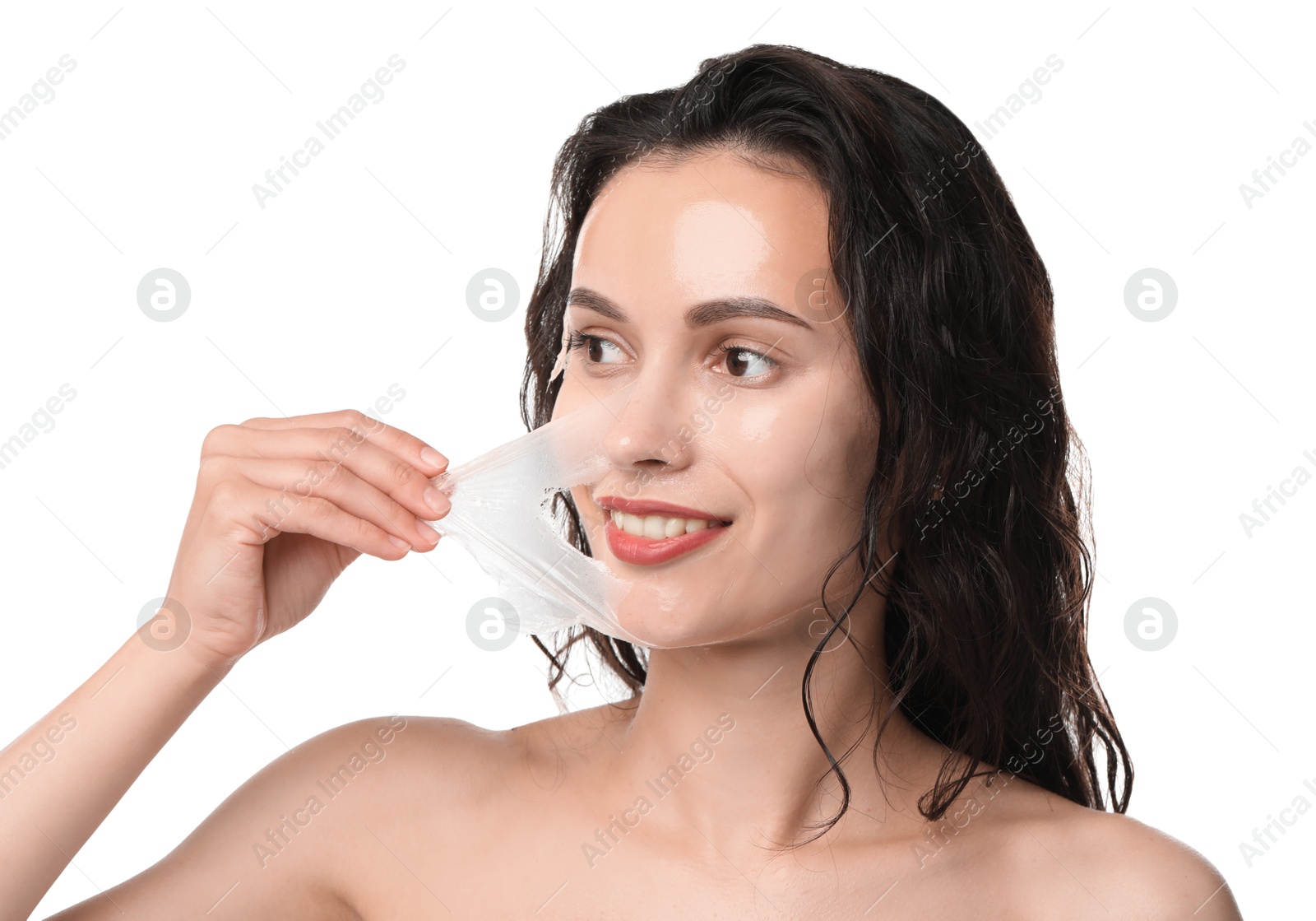 Photo of Smiling woman peeling off face mask on white background