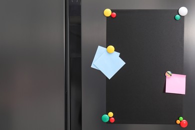 Black magnetic board and notes on refrigerator