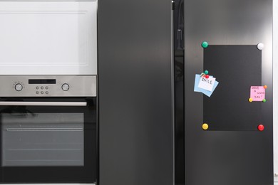 Magnetic board and notes on refrigerator in kitchen