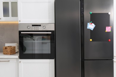 Magnetic board and notes on refrigerator in kitchen